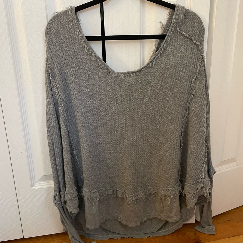 Distressed oversized free people shirt.